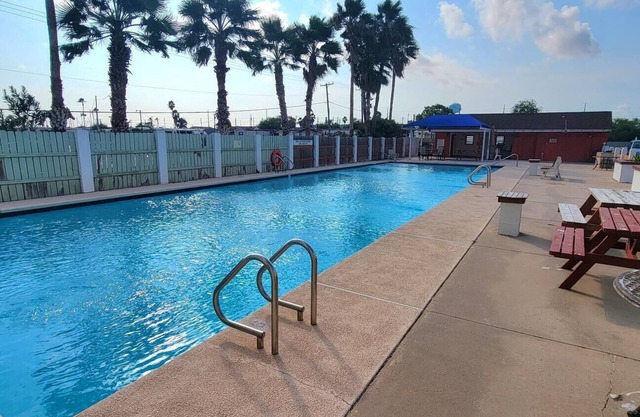 waterfront - boat slip - pool - bay sunset views