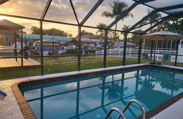 waterfront home, in a canal of the Caloosahatchee River with direct Gulf access.