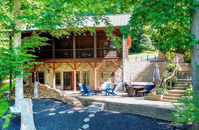 Waterfront Log Cabin w/Hot Tub, Kayaks, Firepit, King Beds, & Pets OK