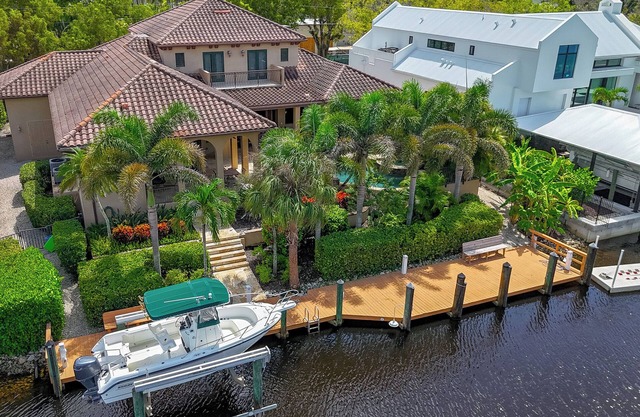 Waterfront Paradise in Aqualane Shores | 4BR Estate with Pool & Dock
