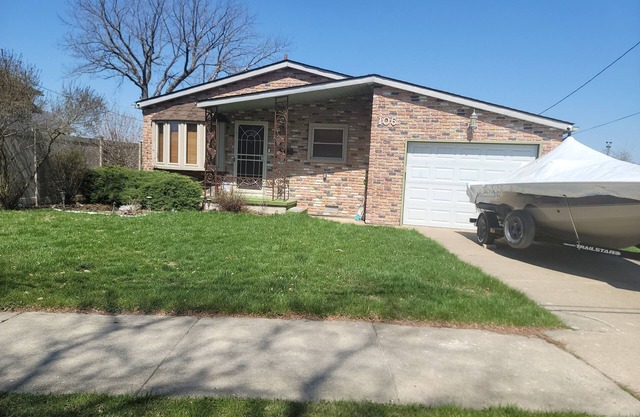 Waterfront with Boat Dock on Detroit River Channel. Fish from the backyard