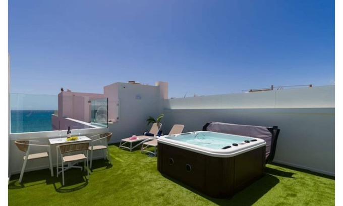 Playa de Arinaga Apartment | 1 beach line exclusive terrace/jacuzzi