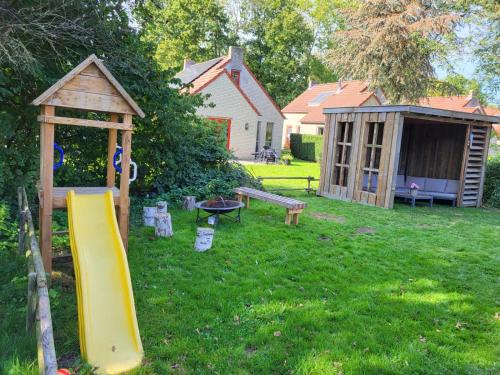 Ewijk House | 7 person House with garden, firepit, swimming lake, hammock, child friendly, in- and outside playground, slide, and great coffee