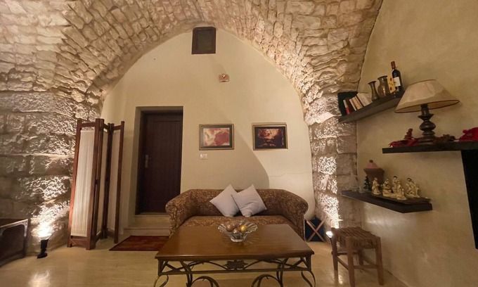 Damour House | A renovated historic rock house with two vaults