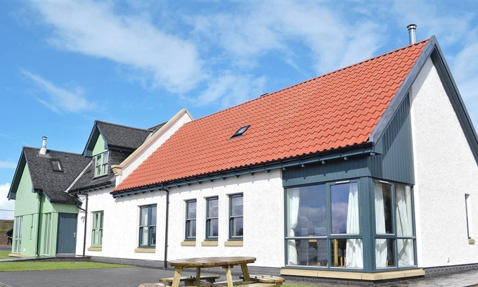 Linlithgow Cottage | A rural property based on a working farm with wood burner.