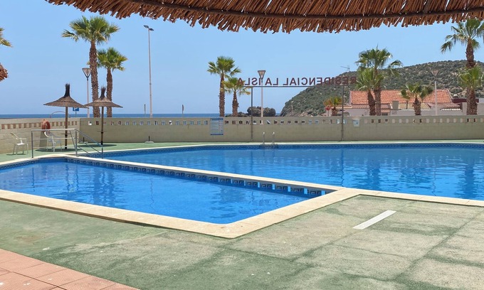 Puerto de Mazarron Apartment | Accessible apartment 50 metres to beach ,large communal pool, sea view balcony