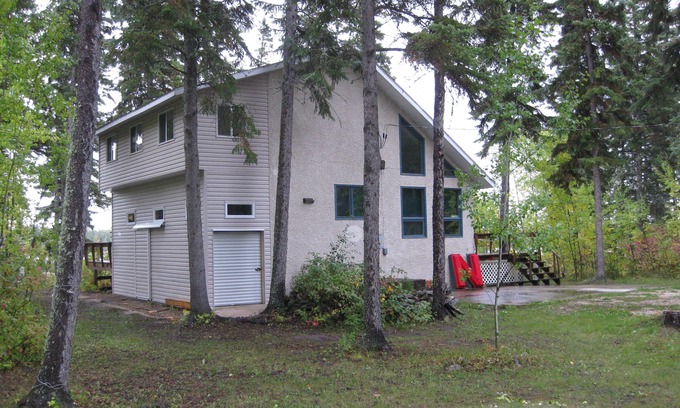 The Pas House | Adventure Awaits at this Lakeside Retreat, #9 Rocky Lake North!
