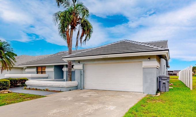 Boynton Beach House | Airy home with pond views, private pool, game room, and dog-friendly