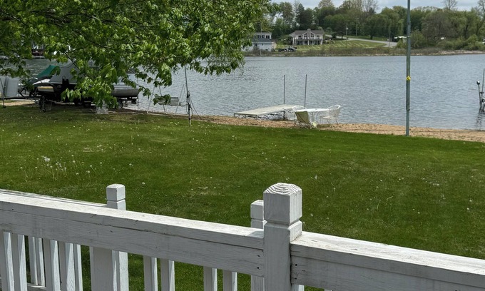 Smyrna Cottage | AllSports lakefront cottage. 3 bedrooms, 2 baths, private beach, yard and deck