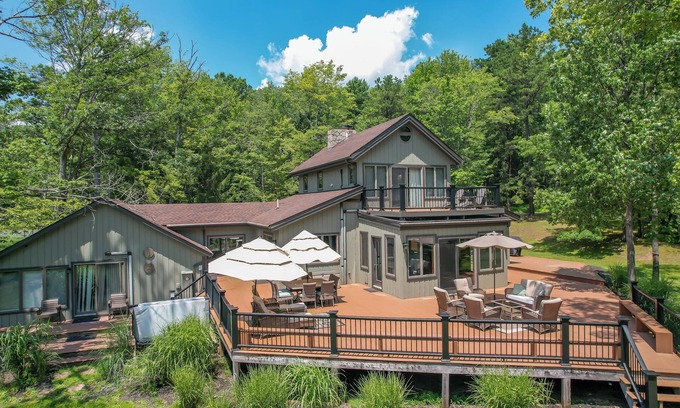 Swanton House | Amazing Outdoor Amenities: Tons of Seating, Dock, Hot Tub, Fire Pit + More