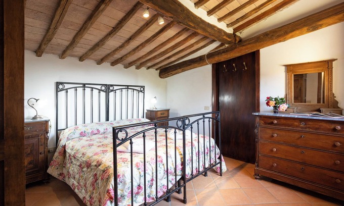 Siena House | Attic room with exposed beams, rustic Tuscan style