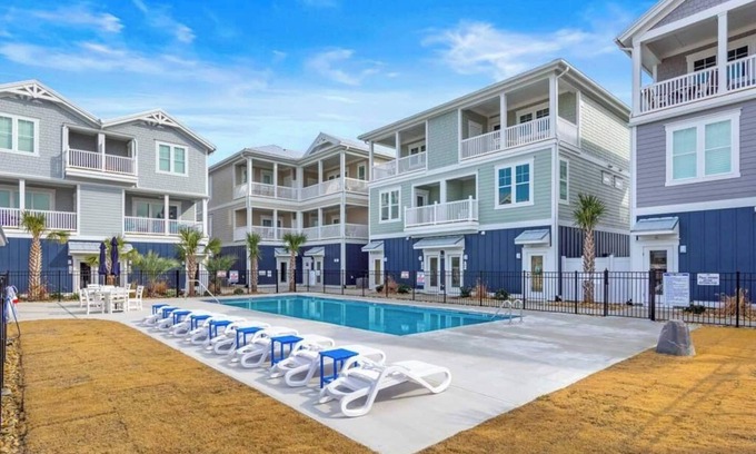 Emerald Isle Apartment | Beautiful beach views with top floor living area. Professionally decorated. Walkable to shops and attractions.