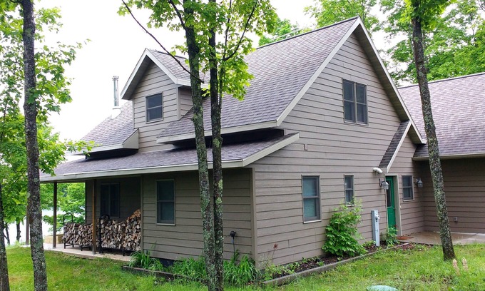 Iron River House | Beautiful newer home on the sunny side of peaceful Camp Lake in Iron River