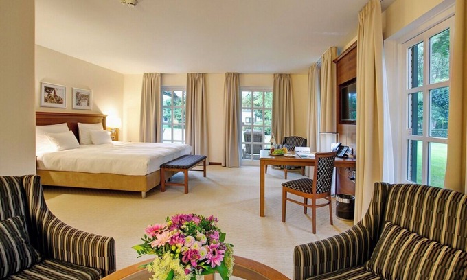 Ootmarsum Hotel | Beautifully Lit Room Overlooking Lush Parkland in Ootmarsum with Wellness Area