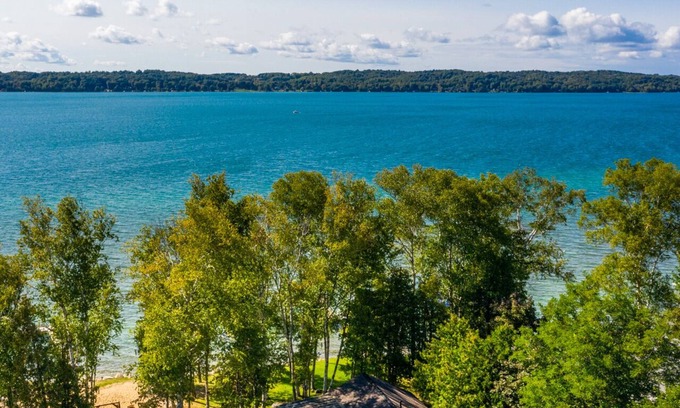 Alden Cottage | Birch Cottage Torch Lake Waterfront with Sunset Views, Kayaks and Paddleboards