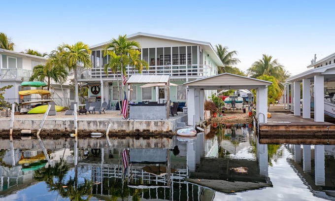 Little Torch Key House | Canal-front Keys escape with amazing view, boat access, firepit, gril, AC, & W/D