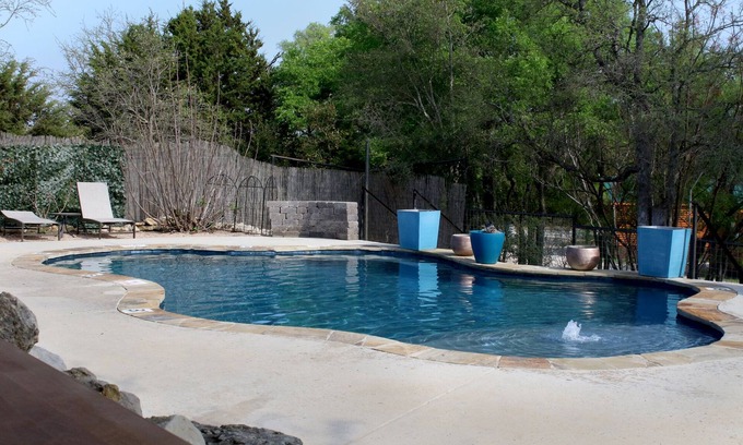 Pipe Creek RV Rental | Canvas Tipi on wooden deck overlooking a season creek.