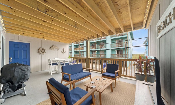 North Carolina Coast Condo | Charming 2-bedroom condo with large covered front porch and partial ocean view!