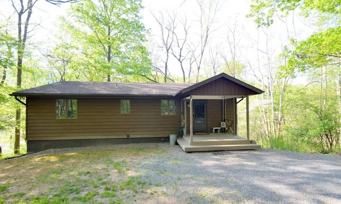 Great Cacapon House | Chesnutt Cabin - riverfront, fire pit, fireplace, game room, king bed