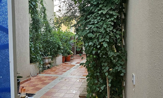 Riyadh Apartment | Chic 1-bedroom living room kitchen small garden. with WiFi, AC in Riyadh