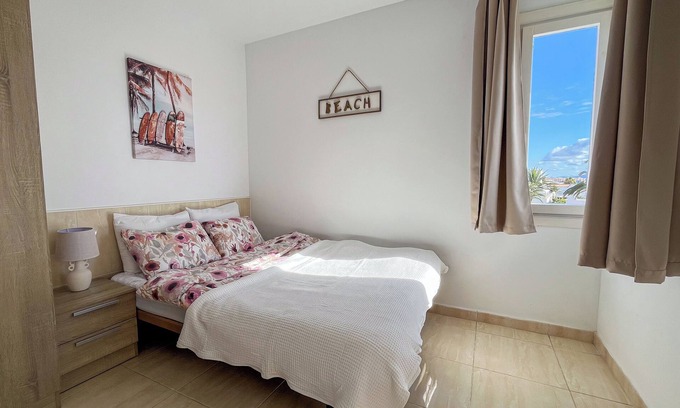 Corralejo Apartment | City Center Coastal Studio, Ocean View, Pool, WiFi