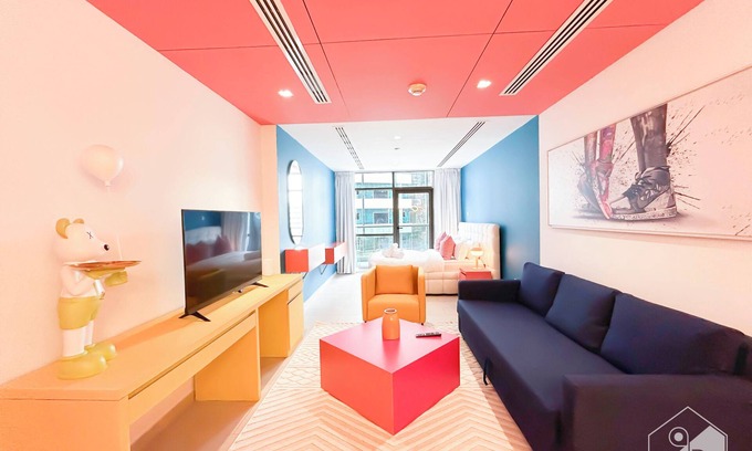 Dubai Sports City Apartment | Colorful Studio with Balcony & City Views