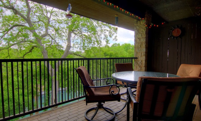 New Braunfels Condo | Comal Riverfront with 2 decks! Schlitterbahn! Pool, hot tub & river access!