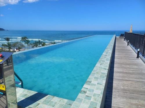 Praia Grande Apartment | Condomínio Bambu - conforto e estilo pertinho do mar