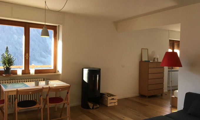 Paquier Apartment | Contemporary apartment with wood burning stove and private terrace with mountain views