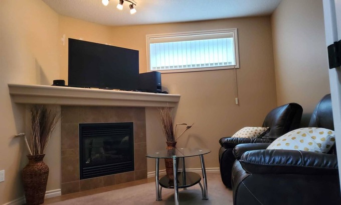 Southeast Edmonton House | Contemporary & Cheerful 1-Bedroom Suite with Fireplace