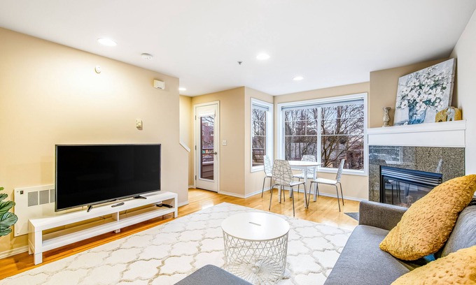 Loyal Heights House | Corner Townhome with Deck, Tons of Natural Light, WiFi, & Gas Fireplace