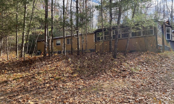 Lakewood House | Cozi retreat set in the woods within walking distance of Waubee Lake.