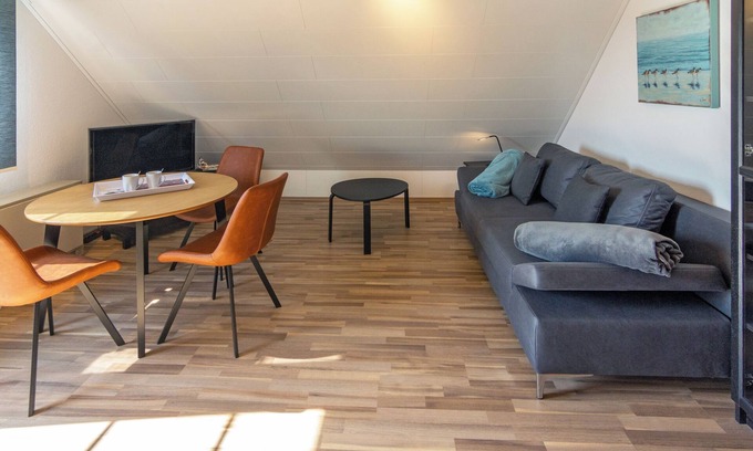 Westeraccumersiel Apartment | Cozy upper apartment Smutje with infrared cabin