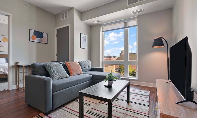 Downtown Minneapolis Apartment | CozySuites Marquee | pool, gym #10