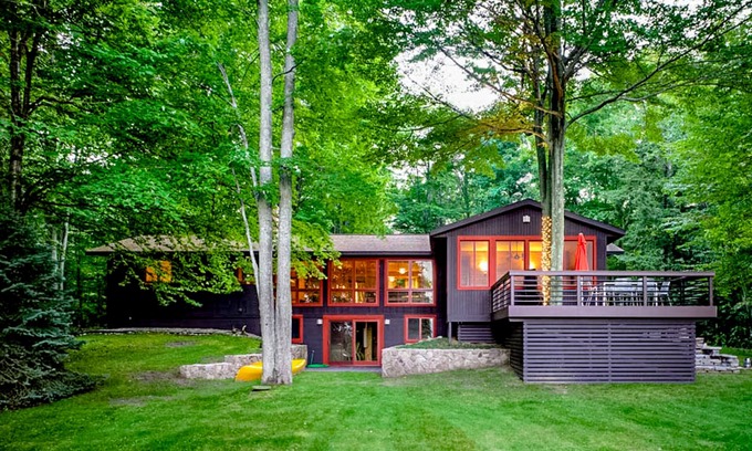 Lake Township House | Custom-designed lake house with screened porch, deck, Ping-Pong & lawn games
