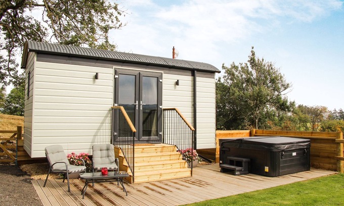 Newcastle-on-Clun Cabin | Cwm Cariad - Shepherds Hut with Hot Tub Sleeping 2 guests, Pet Friendly