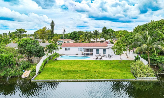 Pompano Beach House | Dog-friendly canal-front home with pool, foosball, washer/dryer, & central AC
