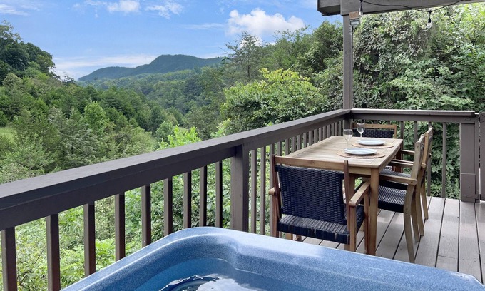 Sevierville Cabin | Dollywood 1 mi! Mountain View, Hot Tub, Fire Pit, King Suites, Arcade, Dogs OK!