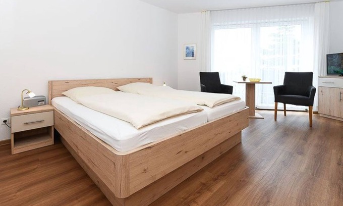 Neuharlingersiel Cottage | Double room with balcony or terrace - Double room in the Hotel-Pension