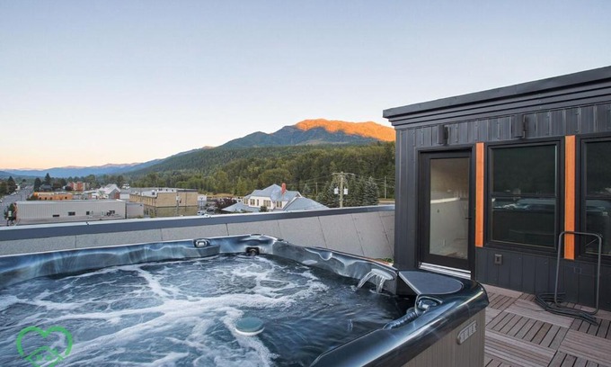 Historic Downtown Fernie Apartment | Downtown Loft with Rooftop Hot Tub by StayIn