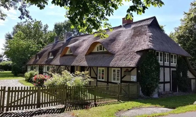 Schaprode Apartment | Dusty rose cozy attic apartment with garden view for persons