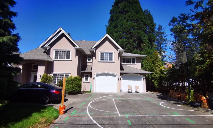 Cordova Bay House | Eagle's guest suits: two bedrooms living room private kitchen and full washroom