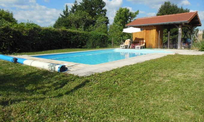Renaison Cottage | Family cottage with shared pool and fireplace in Renaison