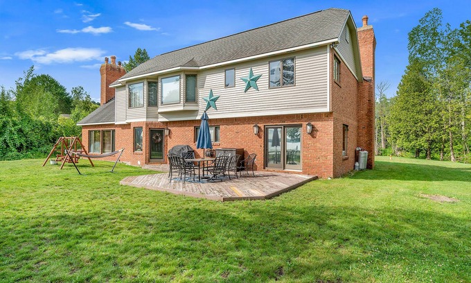 Lake Township House | Family-Friendly Lake View Home with Patio, Grill, Deck, Fireplace, & Free WiFi