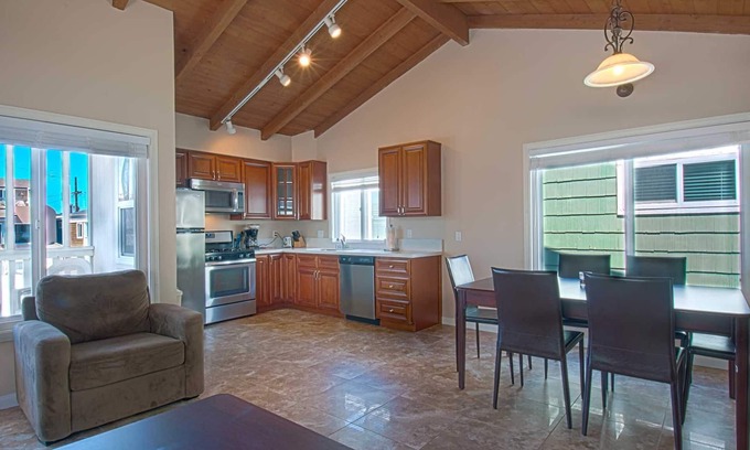 West Newport Condo | Fantastic and newly-remodeled upper unit just one house from the warm sand