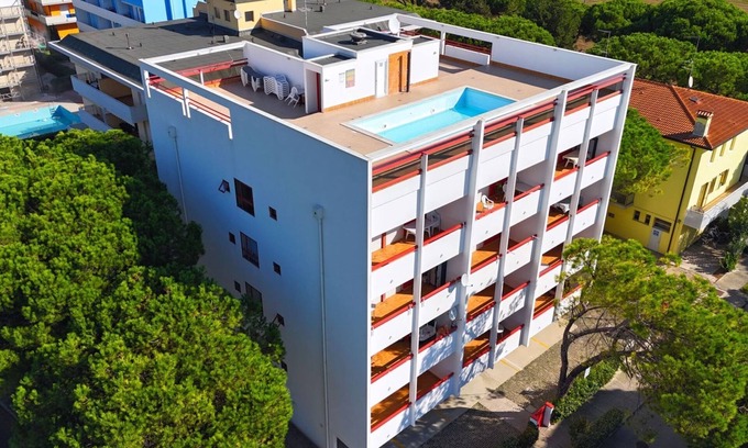Bibione Apartment | Flat in a building with pool