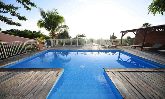 Deshaies Apartment | Fuchsia apartment in a postcard setting overlooking the Caribbean Sea