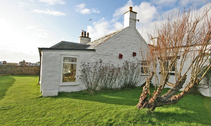 Southerness Cottage | This beach front cottage oozes charm, in a stunning location with sea views.
