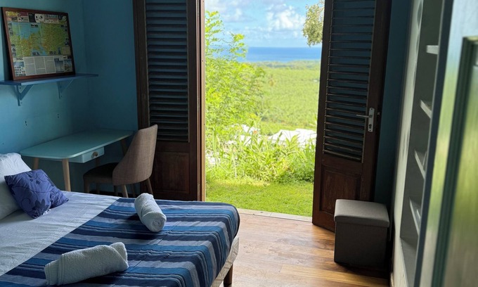 Capesterre-Belle-Eau Bed & Breakfast | Get away from it all: bedroom in architect-designed house with sea view!