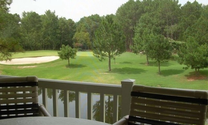 Sunset Beach Condo | GOLF COURSE CONDO - POND VIEWS & FREE NETFLIX